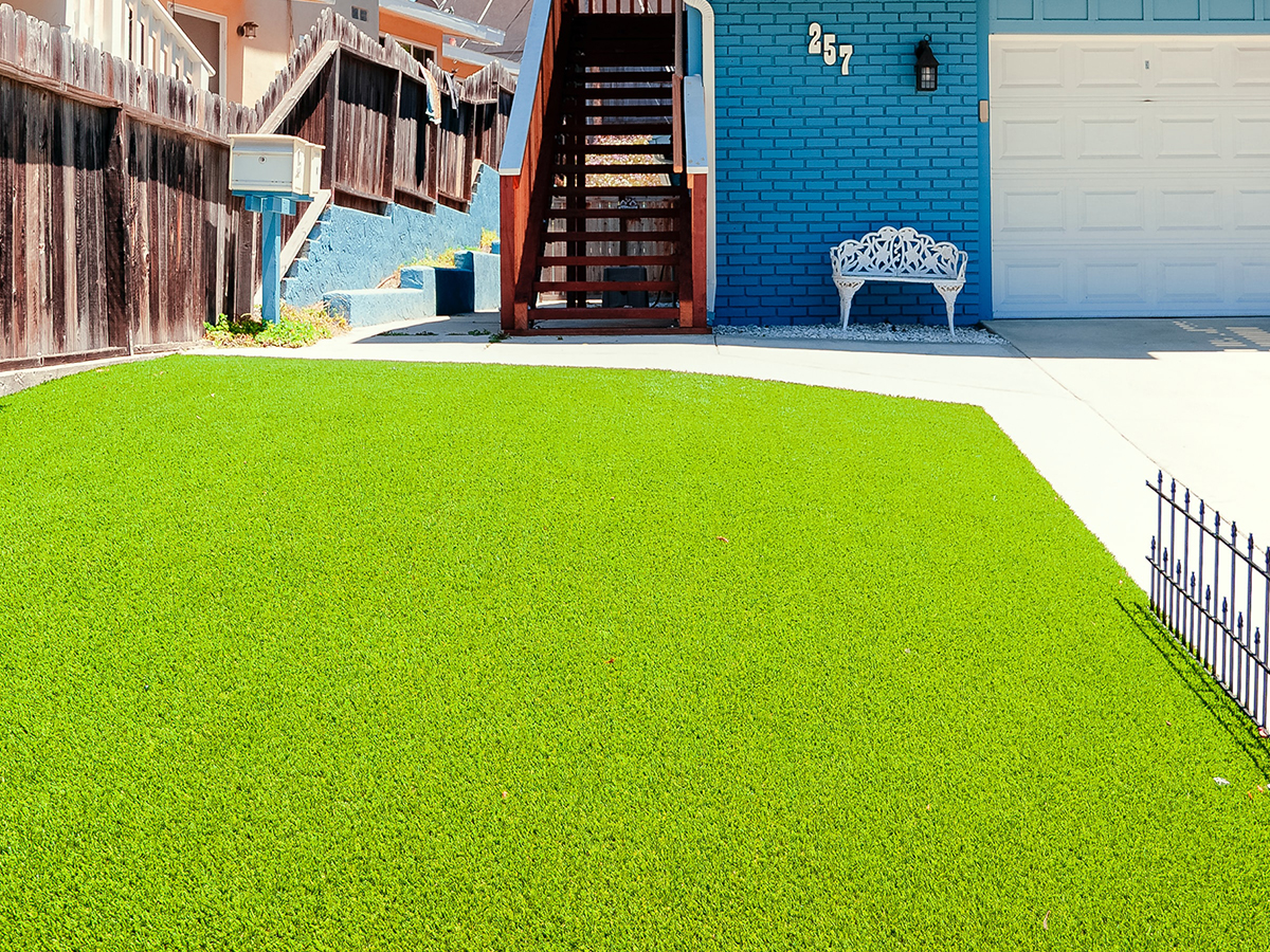 House with artificial grass in the front yard