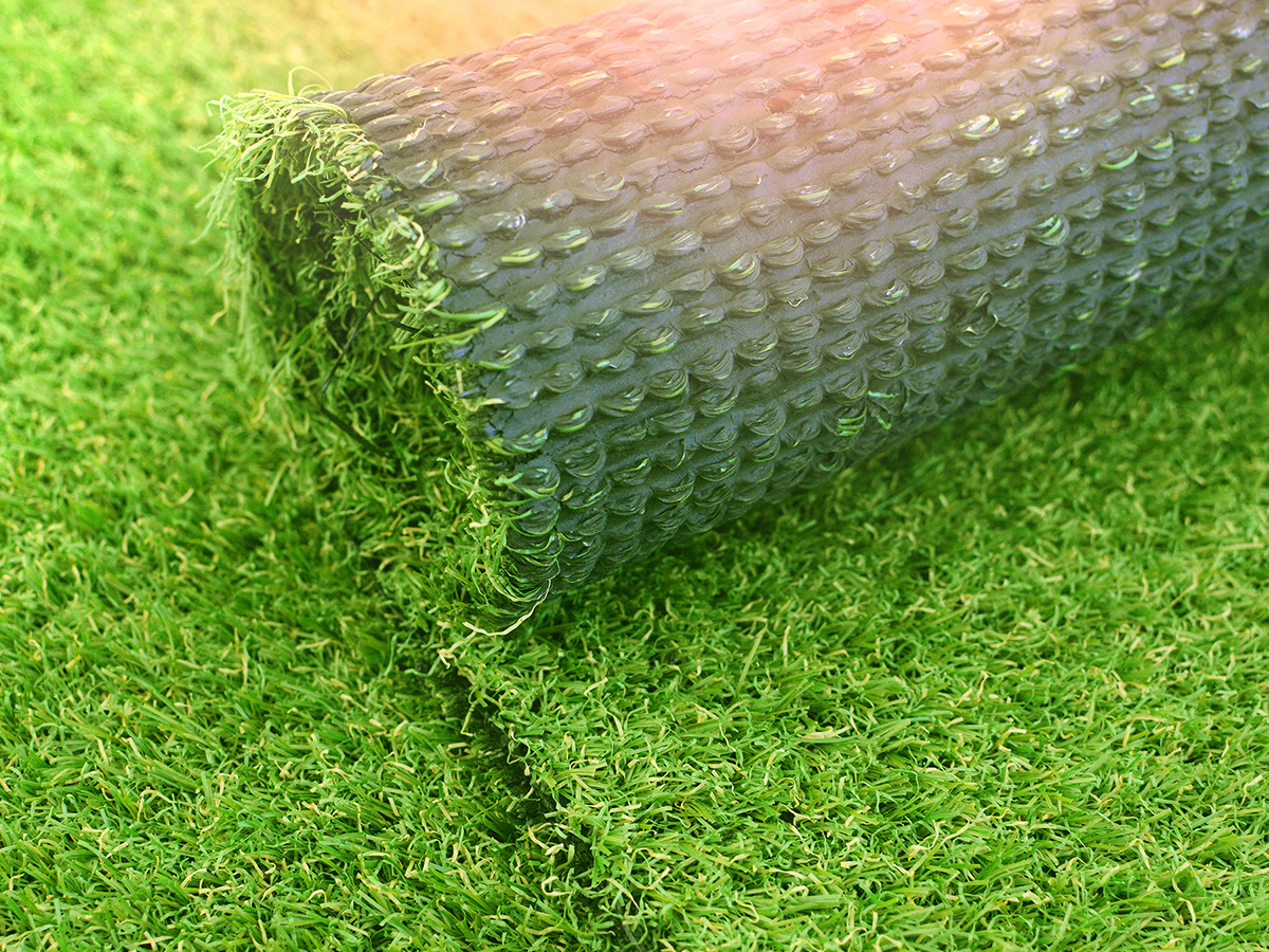 Roll of artificial grass pulled up